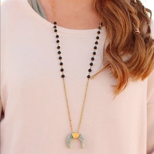 Jade crescent essential oil diffuser necklace.
